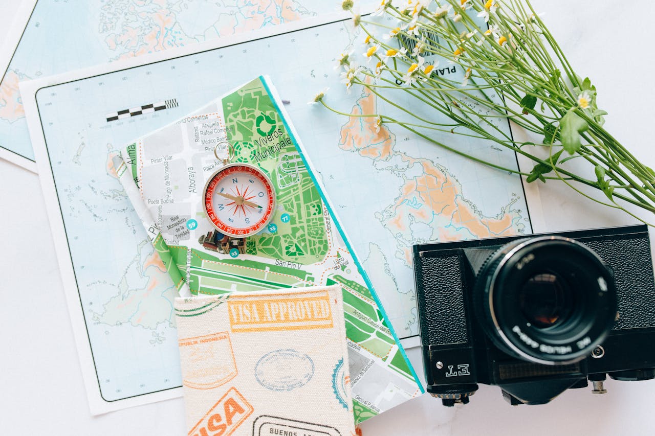 Explore your wanderlust with maps, a compass, and a vintage camera.